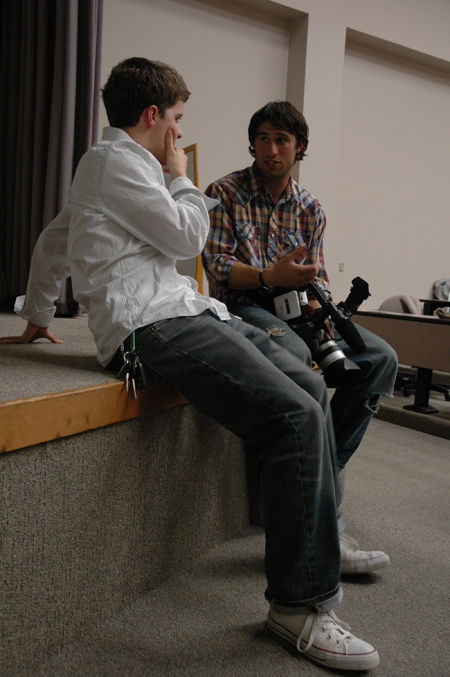Freshman Matt Elia speaks with one of the filmmakers after the Union showing of <em>Invisible Children</em>.