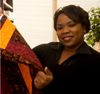 1/26/06 - Senior Kimberly Brown, of New Orleans, one of 11 students who transferred to Union in the fall because of Hurricane Katrina, selects a quilt made by Kindred Spirits Quilters, from Hydewood Park Baptist Church in North Plainfield, N.J.