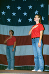 10/11/02 - English major Erin Hetzel and Accounting major Sherryl Schrock participate the junior class' patriotic act during the SAC Variety Show.