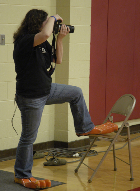 Mallory McHendry focuses on her subject while others focus on her feet.
