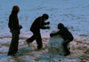 02/10/06 - Jennifer May and the Herr boys destroy an old snowman outside of the McAfee commons.
