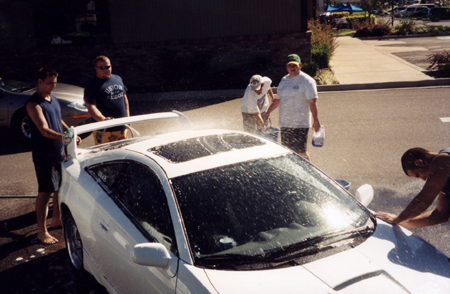 Lambda Chi Cares: Members wash cars to raise money for the Second Harvest Food Bank.
