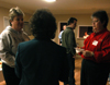 Computing Services' Karen McWherter and Connie Magers fellowship with other computer science alums at the LXA house during Homecoming 2006. - Photo by Heather Phillips
