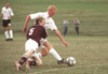 10/8/02 - Freshman forward, Jared New, journalism major goes for a side kick as a opponent comes crashing into him. Union players beat Freed-Hardeman 9-1 scoring their second conference victory.