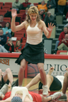 Jeff Norris performs as a cheerleader at the homecoming game with the rest of the men of SAE. - Photo by Kyle Kurlick