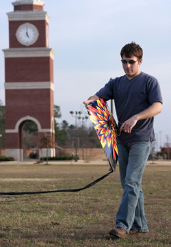 2/28/2006 - David Hancock prepares to fly his kite on a warm and windy February day at Union (ID: 4753)