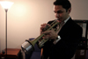 02/27/06 - Cosmin Jinariu plays his trumpet at the Coffee House night for Rounders sign-ups, held Feb. 27 in the student lounge. - Kyle Kurlick