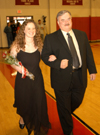 Senior Kathleen Lokey, a social work major from Columbia, Tenn., is escorted by her father Mike Lokey in the Homecoming Court processional. - Photo by Morris Abernathy