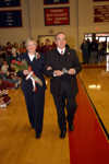 02/25/06 - David and Lanese Dockery bring in the homecoming queen crown during the Homecoming Court processional.