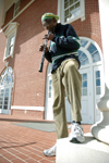 Henry Thomas plays an oboe in front of Jennings Hall. Thomas has played with musical personalities such as Barry White, Rita Marley and Electric Light Orchestra while visiting countries like England, Jamaica and Switzerland. - Photo by Brad Moore