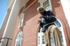 Henry Thomas plays an oboe in front of Jennings Hall. Thomas has played with musical personalities such as Barry White, Rita Marley and Electric Light Orchestra while visiting countries like England, Jamaica and Switzerland. - Photo by Brad Moore