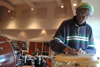 Henry Thomas jams out on a conga drum in the orchestra room of Jennings Hall. Thomas has played with musical personalities such as Barry White, Rita Marley and Electric Light Orchestra while visiting countries like England, Jamaica and Switzerland. - Photo by Brad Moore