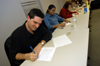 Members of Michael Stewart's MIS MBA class on the Germantown campus take a test. - Photo by Morris Abernathy