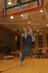 During Midnight Madness, Sophomore Music major Titus Bartos tries his hand in the Slam Dunk Competiton only to fall a little short. - Photo by Jim Veneman