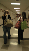 <em>C&C Photo Story:</em> Tricia Currin and Kristin
Veach gather their books and head down the hall to go to a school Valentine's Day dance. After
the dance they head for home to get ready for the next day before going to bed. - Photo by Heather Phillips