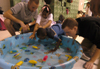 Jason Polk and Jonathon Russnoggle run a game in a swimming pool at the Jackson Boys & Girls Club during The Spring Fling. The Spring Fling was an activity where the Club and SASW collaborated to make a day of excitement for at-risk kids while giving student social workers experience. - Photo by Heather Phillips