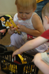 Students prepare for a musical game in the Kindermusik program at the Community Music Center. - Photo by Heather Phillips