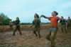 Sophomore Stephanie Butler, Seth Massa, Amy Yarbourgh, Tiffany Windall, and Jonathan Blair celebrate after a successful hit in an mud intramural volleyball game. - Photo by Janelle Sou