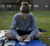 05/8/06 - Junior Angela White spent some time studying for finals outside her dorm room in the McAfee complex.