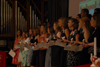 BSN graduates finish passing the light from lamp to lamp during the lamplighting ceremony. - Photo by Morris Abernathy