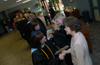 Pam Sutton, professor of English, and Karen Miller, coordinator of continuing studies, are congratulated by the faculty after receiving the faculty and staff members of the year. - Photo by Morris Abernathy
