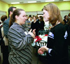 Heather Mercer spends some time with Theatre major Lindsey Garner after a luncheon. - Photo by Jim Veneman