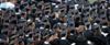 Graduates prepared to receive their diplomas on the Great Lawn during the spring graduation ceremony. - Photo by Morris Abernathy
