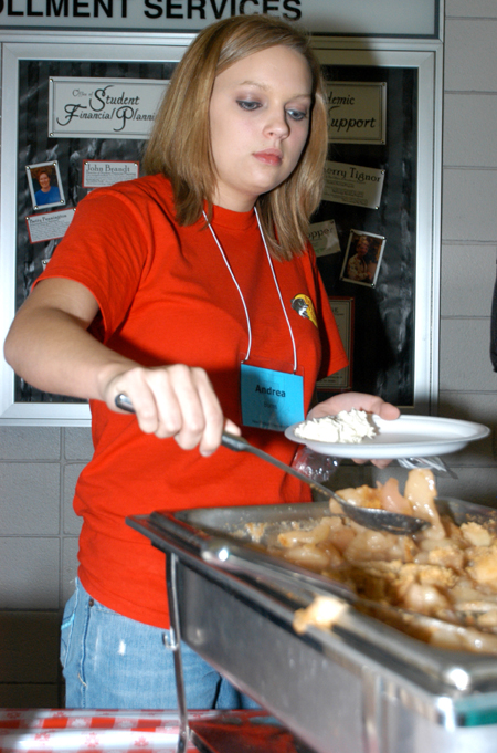 Freshman Andrea Burns of Ramer, Tenn. enjoys some apple cobbler during New Student Orientation.