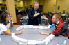 08/29/05 - President Dockery officiates an intense game of spoon hockey between Lydia Livingston & Luke Pruett during the Ice Cream Social at New Student Orientation.