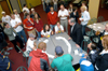 08/29/05 - A crowd gathers as President Dockery officiates an intense game of spoon hockey during the Ice Cream Social at New Student Orientation.