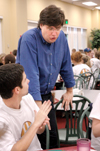 Chris Blair, associate professor of communication arts and coordinator of digital media studies, talks with Drew Rhodes during New Student Orientation. - Photo by Kristen Nicole Sayres