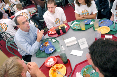George Guthrie, Benjamin W. Perry professor of Bible, talks with incoming Christian studies students during a New Student Orientation dinner.