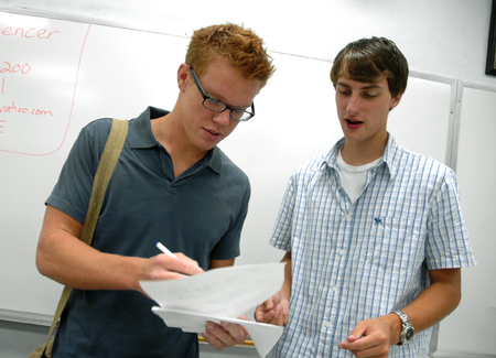 Mark Inman & Jonathan Moore get organized in their Focus group during New Student Orientation.