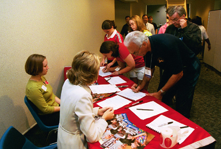 Senior Emily Price and Union enrollment counselor Wendy Veazey register guests for the Alumni and Friends Reception during the Southern Baptist Convention.