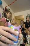 09/8/05 - Katie Daniel, an RA in Blythe in the Hurt complex, talks with Andrea Sarine, Karie Thomas, and other girls during a progressive dinner party.  The party began in one room and progressed to other rooms in upper Blythe, where different foods were served.