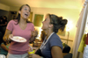 09/8/05 - Katie Daniel, RA of upper Blythe, jokes around with Candace Cross during a progressive dinner party in upper Blythe.  The party began in one room and progressed to other rooms in upper Blythe, where different foods were served.