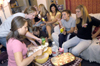 09/8/05 - The girls of upper Blythe in Hurt complex enjoy food and fellowship during a progressive dinner party. The party began in one room and progressed to other rooms in upper Blythe, where different foods were served.