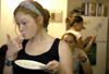 09/8/05 - Lily Zopfi tastes the last bit of her food during a progressive dinner party in upper Blythe in the Hurt complex. The party began in one room and progressed to other rooms in upper Blythe, where different foods were served.