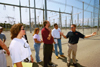 Wayne Wofford, center, led the environmental ethics class that was taught this past summer. Here students took a field trip to a local power plant. - Photo by Jim Veneman