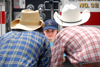 A couple of cowboys fellowship with a youngster during a Make-A-Wish event. - Photo by Kristen Nicole Sayres