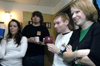 12/2/05 - Brynn Miller, Kevin Roe, Brian Burns, Sarah Eastin attend a dorm room Christmas party.