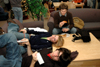 12/13/05 - Ben Bailey, Bekah Bothwell and Ronald Long enjoy some finals pizza in the McAfee Commons.