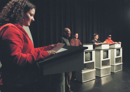 Assignment: <i>Head to Head</i> - Sophomore Ashley Mitchell poses a number of trivia quetions to each contestant.