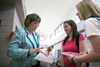 Resa Harris and Kellie Roe learn about a local social work initiative during Social Work Awareness Day. - Photo by Kyle Kurlick