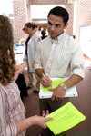 Cosmin Jinariu fills out an interest card for Kathleen Lokey during Social Work Awareness Day. - Photo by Kyle Kurlick