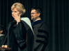 Pam Sutton wipes her eyes after just being named faculty member of the year during Awards Day.  Also pictured is Chris Hail, faculty member of the year 2004-2005. - Photo by Kyle Kurlick