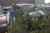 Sophomore Katie Grashot from Millington, TN calls her insurance company about the damage sustained to her car as a result of the tornado that hit campus Saturday night. - Photo by Jim Veneman