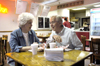 Wayne Johnson and his lovely wife, Carol, munch on some fries and sip some soda as they enjoy some time together after a hard day of work. They shared stories of the day’s events and remnisced about their earlier life experiences. - Photo by Stephanny Rodriguez