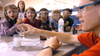 Kenneth Lewoczko performs a chemistry demonstration for children at the Lincoln Elementary School for <em>Mathematics and Science in Jackson</em>. - Photo by Brad Moore