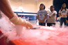 Children watch and react to a chemistry presentation by Nathan Eckley and Andy McBride at the Lincoln Elementary School for <em>Mathematics and Science in Jackson</em>. - Photo by Brad Moore